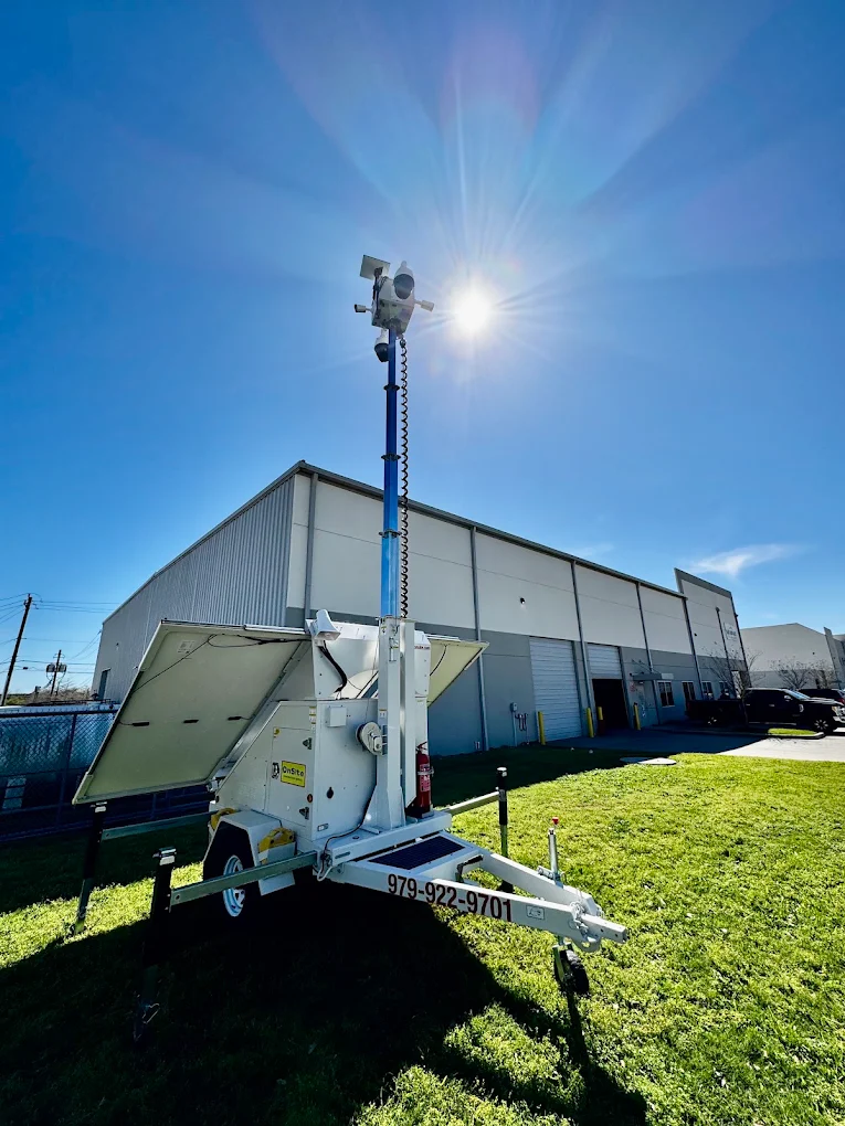 Onsite solar-powered security camera trailer with raised camera mast
